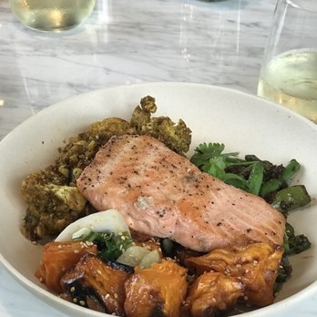 Flower Child - Salmon greens salad corn sweet potatoes - Salad Near Me - Houston, Texas