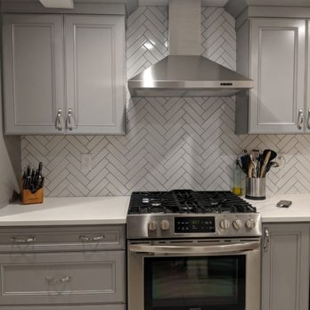 Dole Construction - a modern kitchen with stainless steel appliances - General Contractors Near Me
