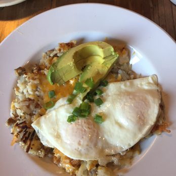 Seven Mile Cafe - Loaded potatoes with easy over eggs, avocado, and pork sausage patties - Breakfast & Brunch Near Me - Denton, Texas