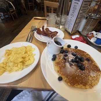 Yolk - Sundance Square - Lemon Blueberry Cakes, scrambled eggs, bacon - Breakfast & Brunch Near Me - Fort Worth, Texas Yolk - Sundance Square - Lemon Blueberry Cakes, scrambled eggs, bacon - Breakfast & Brunch Near Me - Fort Worth, Texas