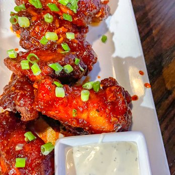 Tavern in the Square - Sriracha Honey Wings - New American Near Me - Wrentham, Massachusetts Tavern in the Square - Sriracha Honey Wings - New American Near Me - Wrentham, Massachusetts