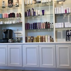 1051 Salon & Spa - They have lots of hair products you can purchase, along with coffee they will happily make you!
