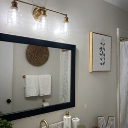 Calming Home By Venus - Upgraded Vanity Light (Gold)
The vanity has a white cultured marble countertop with a gold faucet.