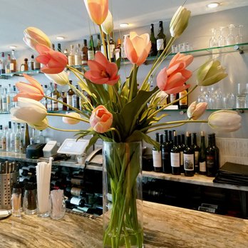 Felice Design Studio - This custom tulip arrangement brightens up the bar - Interior Design Near Me Felice Design Studio - This custom tulip arrangement brightens up the bar - Interior Design Near Me