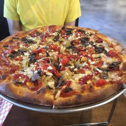 Toss Pizzeria & Pub - Medium Roasted Vegetable pizza with pepperoni added.
