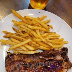 Small rack of ribs with french fries.