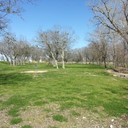 Met Center Disc Golf Course - Hole 18 basket showing the fairway approaching