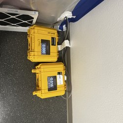 All Dry And Tidy - An example of pressure differential monitor during ongoing work in a hospital, Where controlling potential dust contamination is critical.