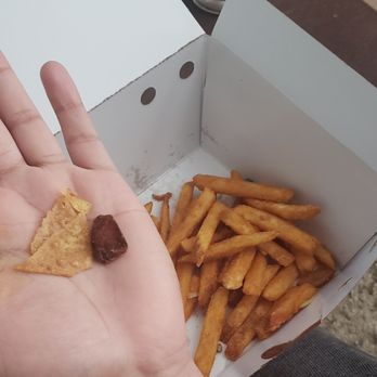 Denny's - Looks like they scrapped the bottom of the fryer, found 2 potato chips and a mystery item in my fries. - American Near Me - Murrieta, California
