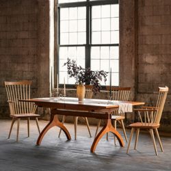 Thos.  Moser - The Wishbone Extension Table and the Eastward Dining chairs crafted from solid North American cherry.