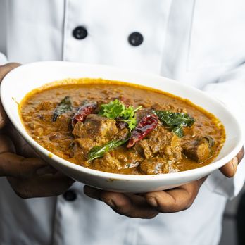 The Yellow Chilli Tustin - Madras Goat Curry
Goat Chunks simmered to perfection in an aromatic curry sauce with coconut - Indian Near Me - Tustin, California The Yellow Chilli Tustin - Madras Goat Curry
Goat Chunks simmered to perfection in an aromatic curry sauce with coconut - Indian Near Me - Tustin, California