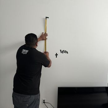 Satellite Bros - Measuring the tv to see if I would like the height - Television Service Providers Near Me