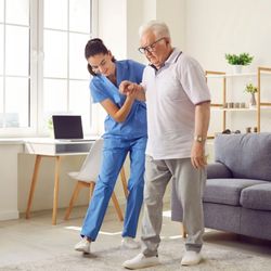 CareMate Home Health Care - A CareMate Home Health Care professional helping a senior with balance and rehabilitation exercises in Saint Paul, Minnesota....