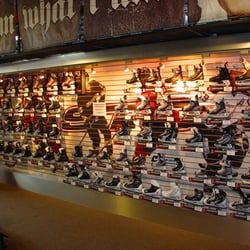 Cyclone Taylor Sports - Surrey - Our skate wall, with an image of hockey legend Fred "Cyclone" Taylor on the far left!