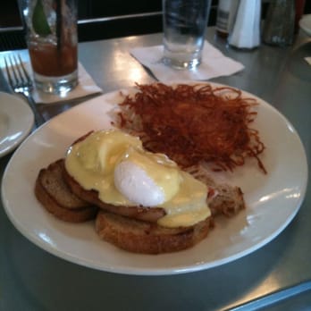 Boon Fly Cafe - Boon Fly Benedict...Artisan Pain Levain, Thick Sliced Ham, Poached Eggs, and Jalapeno Hollandaise with Crispy Hash - American Near Me - Napa, California