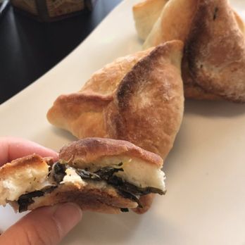 Me'Mo's Middle Eastern Cuisine - Spinach fatayer... it's bread filled with a slightly picketed spinach flavor. It was okay. - Lebanese Near Me - Modesto, California