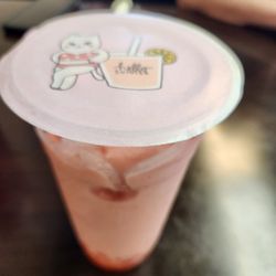 Strawberry bubble tea (blended) with strawberry popping boba!