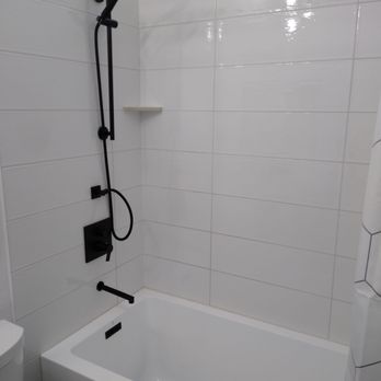 Gerry's Tile & Stone - a bathtub and toilet - General Contractors Near Me