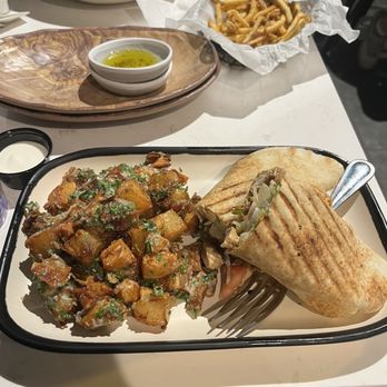 Meddys - I had the Succulent Chicken Shawarma with garlicky potatoes. My fiancé had the Big Bowl with rice and lamb along with fries - Mediterranean Near Me - Kansas City, Missouri Meddys - I had the Succulent Chicken Shawarma with garlicky potatoes. My fiancé had the Big Bowl with rice and lamb along with fries - Mediterranean Near Me - Kansas City, Missouri