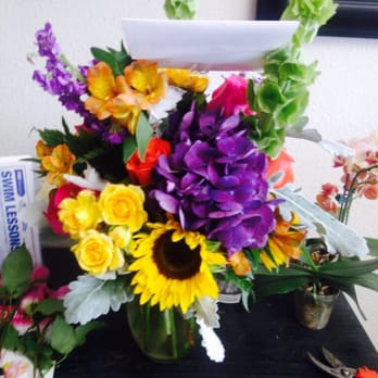 The Dizzy Daisy - picture that was sent to my phone before delivery BACK of arrangement. - Florists Near Me - Orange, California