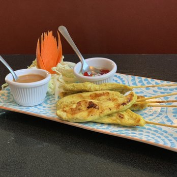 Thai O - Chicken satay with house made peanut sauce and a vinegar based sauce with red bell peppers, onions and cucumbers. - Thai Near Me - Redmond, Oregon Thai O - Chicken satay with house made peanut sauce and a vinegar based sauce with red bell peppers, onions and cucumbers. - Thai Near Me - Redmond, Oregon