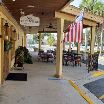 Turners - the outside of a restaurant with tables and chairs - New American Near Me - Leesburg, Florida Turners - the outside of a restaurant with tables and chairs - New American Near Me - Leesburg, Florida