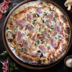 Baked Pizza and Sandwiches - Custom-made pizza with prosciutto.