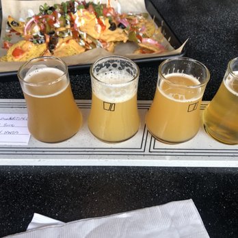 Pilot Project Brewing - Logan Square - Front: Flight ($14) Back: Beer Cheese Nachos ($12) - Breweries Near Me - Chicago, Illinois
