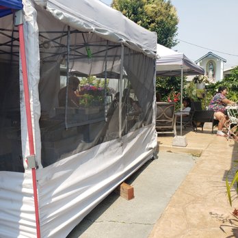 La Birria Tapatia - a tent with a table and chairs - Mexican Near Me - Hayward, California La Birria Tapatia - a tent with a table and chairs - Mexican Near Me - Hayward, California