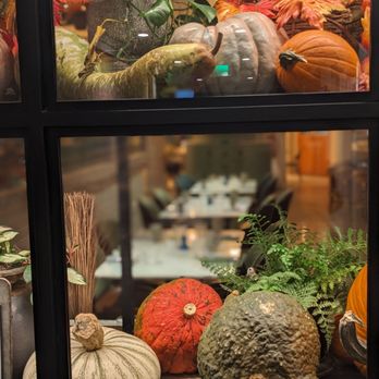 FIG Restaurant - pumpkins and gourds displayed in a glass case - Bars Near Me - Santa Monica, California