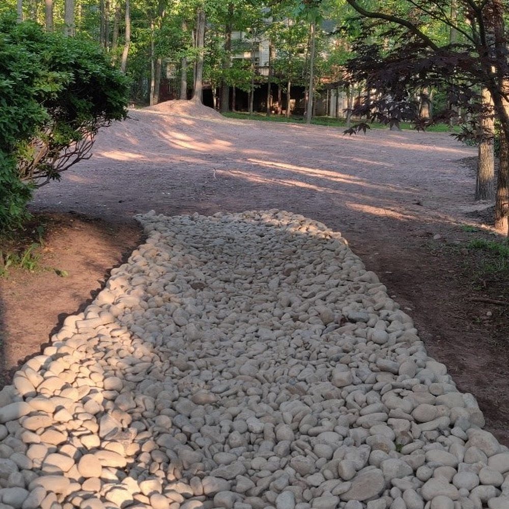 Cassella Design & Build - River Rock Swale - Landscaping Near Me - Springfield, Virginia Cassella Design & Build - River Rock Swale - Landscaping Near Me - Springfield, Virginia
