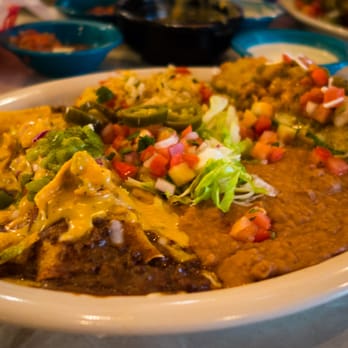 Chuy's - "Heavenly Combo" Frito pie enchilada topped with Hatch green chiles and a chicken and cheese chile relleno. - Tex-Mex Near Me - Tyler, Texas Chuy's - "Heavenly Combo" Frito pie enchilada topped with Hatch green chiles and a chicken and cheese chile relleno. - Tex-Mex Near Me - Tyler, Texas