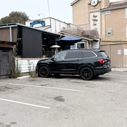 Small private parking lot in back of establishment