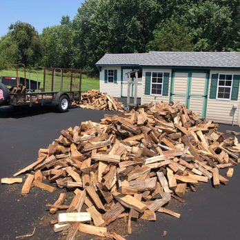 Promise Tree & Landscape Service - a pile of wood in front of a trailer - Tree Services Near Me Promise Tree & Landscape Service - a pile of wood in front of a trailer - Tree Services Near Me