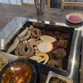 Gopchang Salon - L to R: large intestine, small intestines, tripe, assorted veg, beef heart, abomasum... respectively - Korean Near Me - Suwanee, Georgia