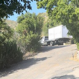 Storage container towed up a hill