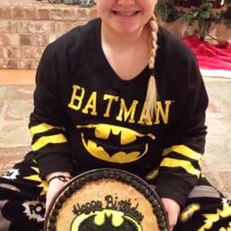 Loves her Batman cookie cake!