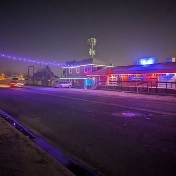 Rustic Rail - The Rustic Rail at night.  The kinda blue lights that Oildale loves to see!! - Bars Near Me - Bakersfield, California
