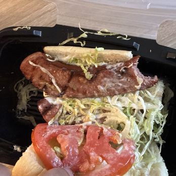 Tibby's New Orleans Kitchen - Hot sausage Poboy that's made with links that are not even spicy - Cajun/Creole Near Me - Brandon, Florida Tibby's New Orleans Kitchen - Hot sausage Poboy that's made with links that are not even spicy - Cajun/Creole Near Me - Brandon, Florida
