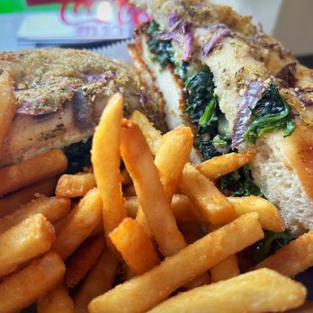 Capri Pizza - Our customers favorite chicken cutlet sandwich w. Spinach & sharp provolone cheese on homemade focaccia bread. Served with French fries - Pizza Near Me - Ventnor City, New Jersey