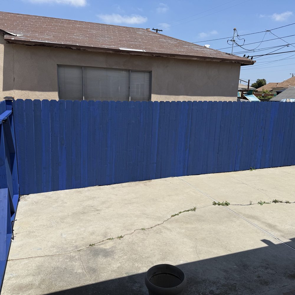 New wood fence. Blue stain. New wood fence. Blue stain.