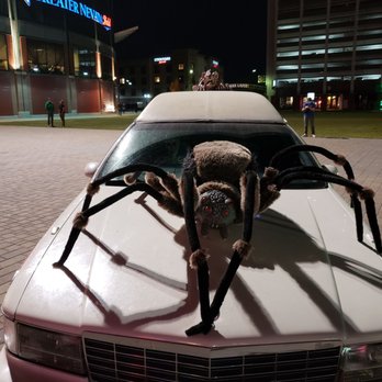 Slaughter House - a giant spider on the hood of a car - Haunted Houses Near Me - Reno, Nevada