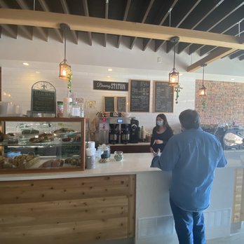 Dean's Coffee - a man standing at a counter in a coffee shop - Coffee & Tea Near Me - Pearl River, New York Dean's Coffee - a man standing at a counter in a coffee shop - Coffee & Tea Near Me - Pearl River, New York