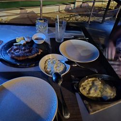 Sea & Stones - Ribeye Steak and garlic mashed potatoes and loaded baked potatoes!