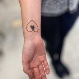 Double heart tattoo