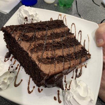 Lester's Diner - We all split a slice of this delectable chocolate cake for dessert. - Diners Near Me - Sunrise, Florida Lester's Diner - We all split a slice of this delectable chocolate cake for dessert. - Diners Near Me - Sunrise, Florida