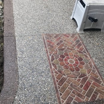 Biondo Cement - a brick walkway with a flower design - General Contractors Near Me - Shelby Township, Michigan