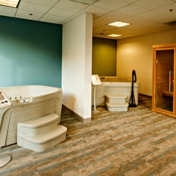 Olympic Hot Tub Service Center - Freeflow- plug & play hot tubs on display.