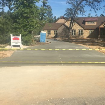Andy's Concrete Construction - a driveway with construction tape around it - General Contractors Near Me Andy's Concrete Construction - a driveway with construction tape around it - General Contractors Near Me