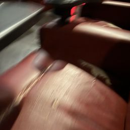 Landmark seats worn and peeling on fake leather recliners